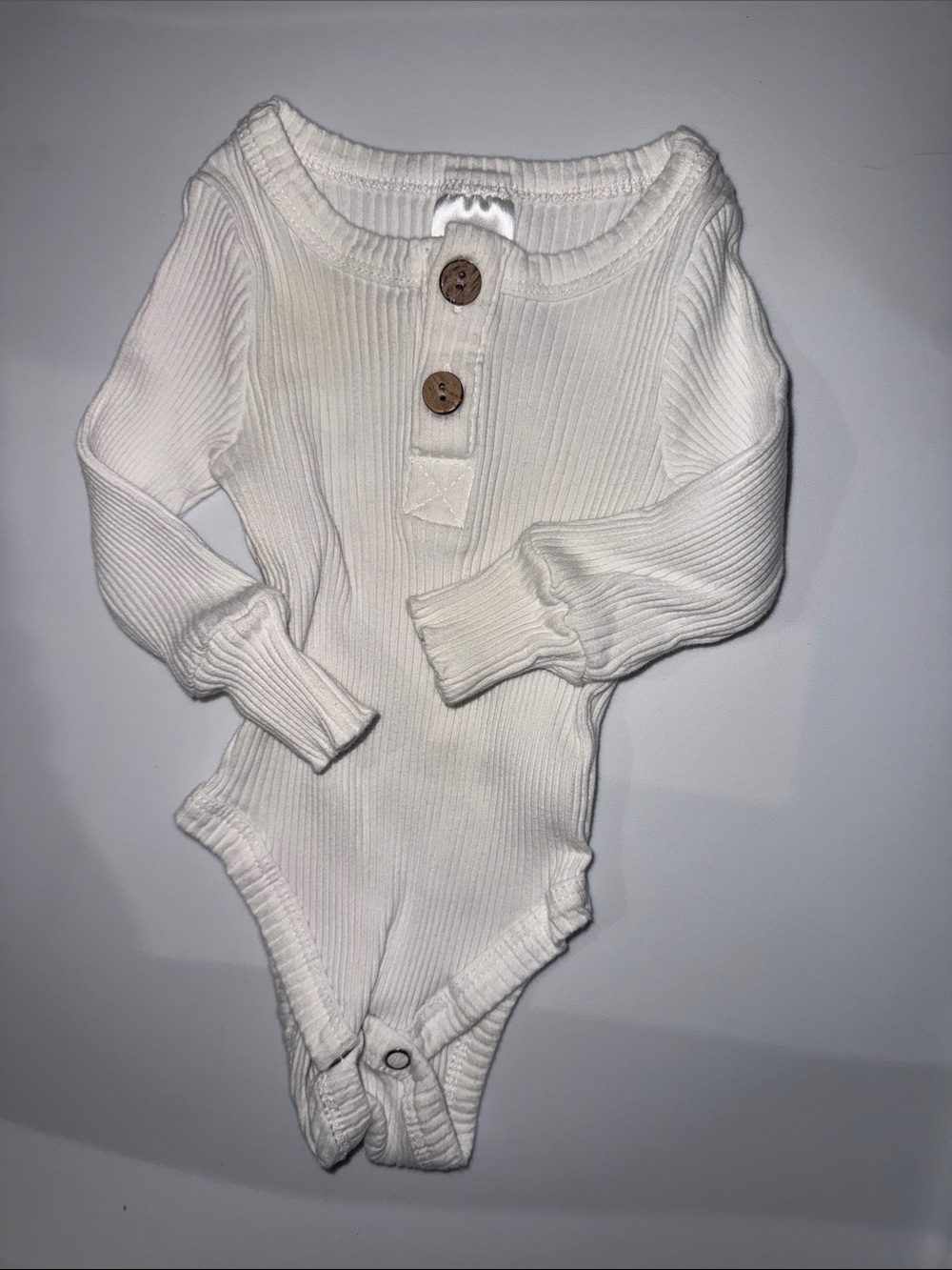 Ribbed White Baby One-Piece Bodysuit with Wooden Buttons